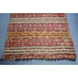 A Kelim rug of striped design; 8'9" x 6'10".