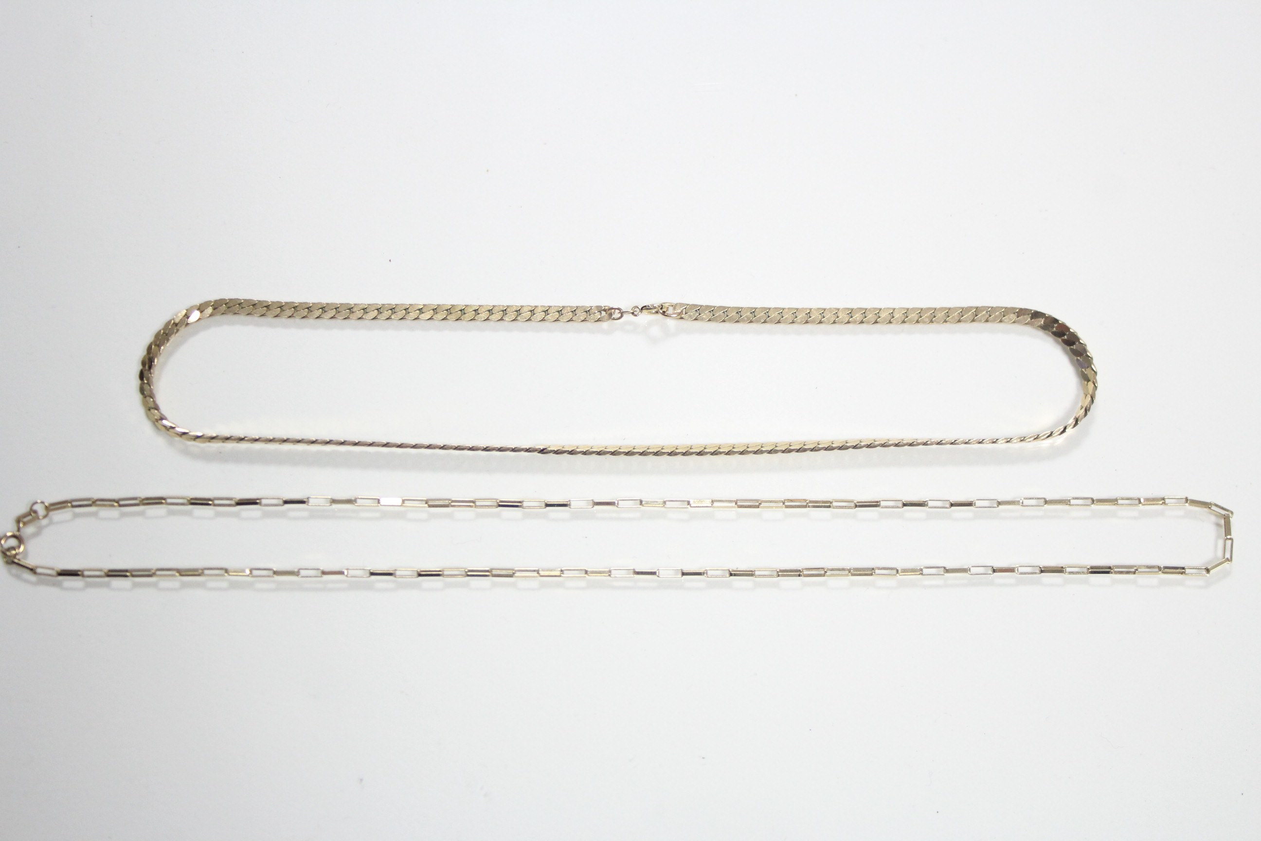 A 9ct. gold necklace of flat curb links, 16" long (14 gm); & another of small oblong links, 20" long - Image 2 of 2