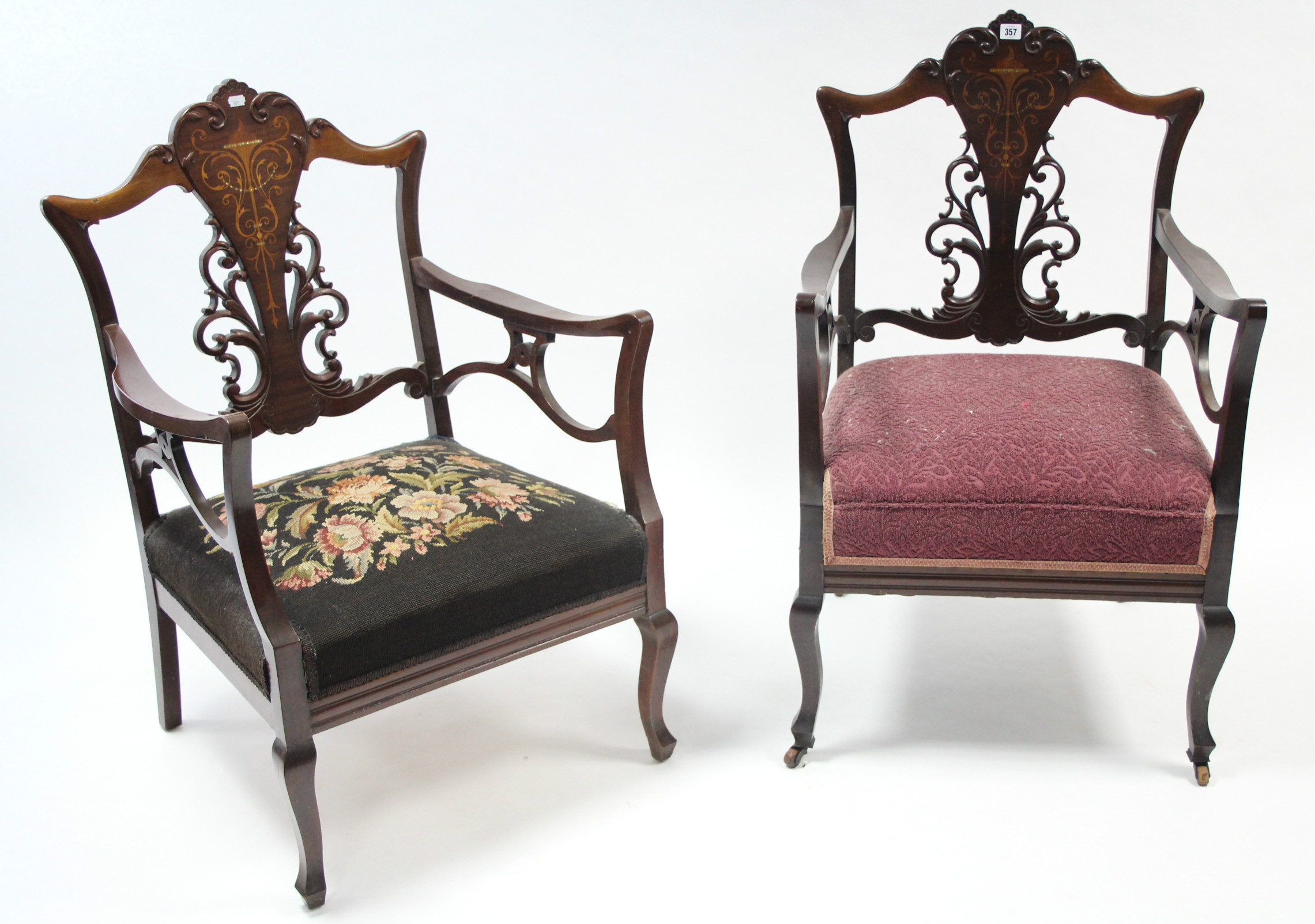 A pair of late 19th century mahogany elbow chairs with marquetry decoration to the pierced splats,