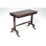 A late 19th century mahogany card table, with rectangular fold-over top on two end supports joined