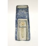 A Troika pottery vase of tapered oblong form, blue ground with incised & relief design, 6¾" high;