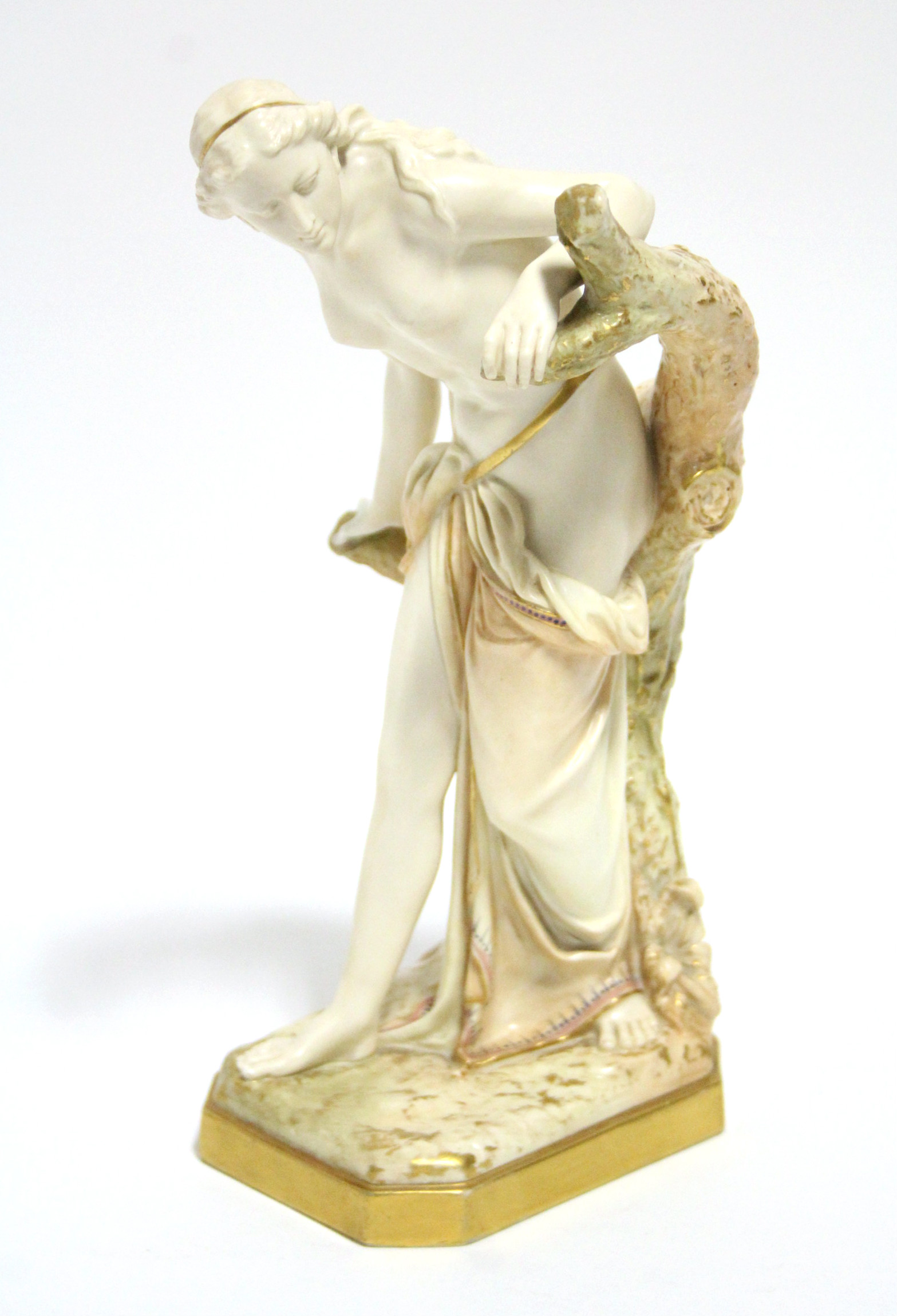 A Royal Worcester ivory-ground porcelain figure of "The Bather Surprised", the robes & tree trunk