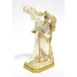 A Royal Worcester ivory-ground porcelain figure of "The Bather Surprised", the robes & tree trunk