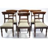 A set of six early Victorian mahogany bow-back dining chairs with padded drop-in seats, & on