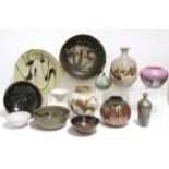 A collection of thirteen various studio pottery & porcelain vases, bowls, & dishes. (One dish broken