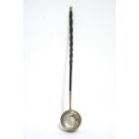 An 18th century punch ladle, the circular “coin” bowl with embossed decoration of birds & flowers, &