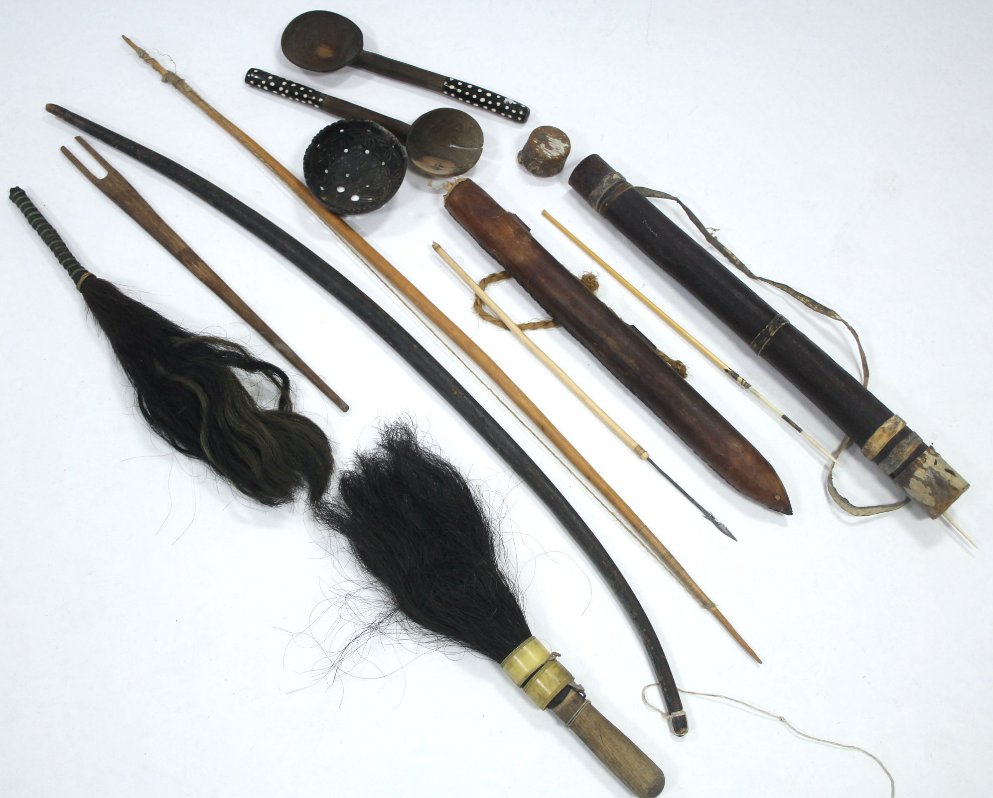 A collection of African artefacts including carved wood masks, spears, bows & arrows, fly-whisks, - Image 2 of 5