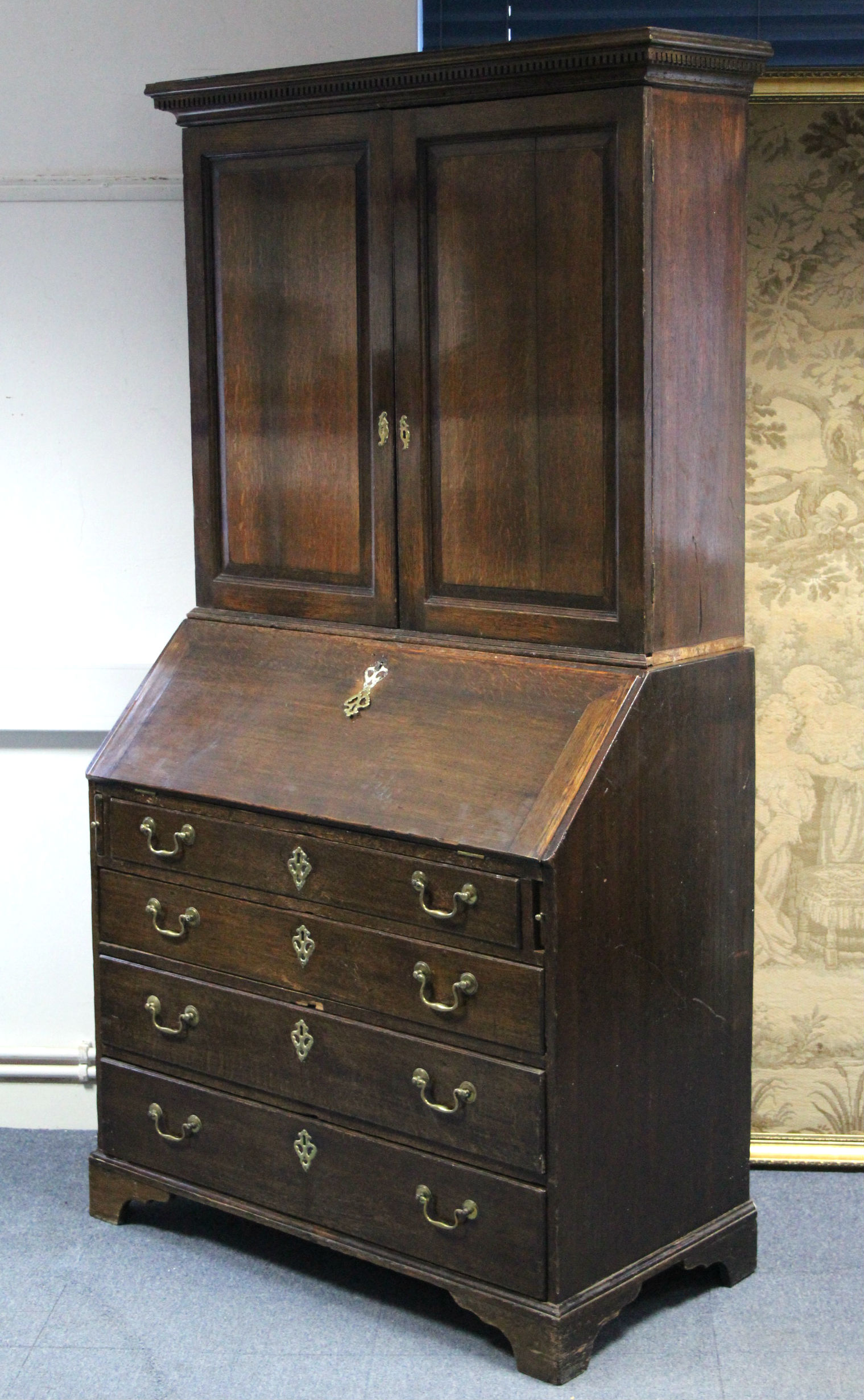 A late 18th century oak bureau-bookcase with adjustable shelves enclosed by a pair of panel doors, - Image 3 of 3