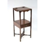 An early 19th century mahogany two-tier square washstand, the undertier fitted small drawer, on