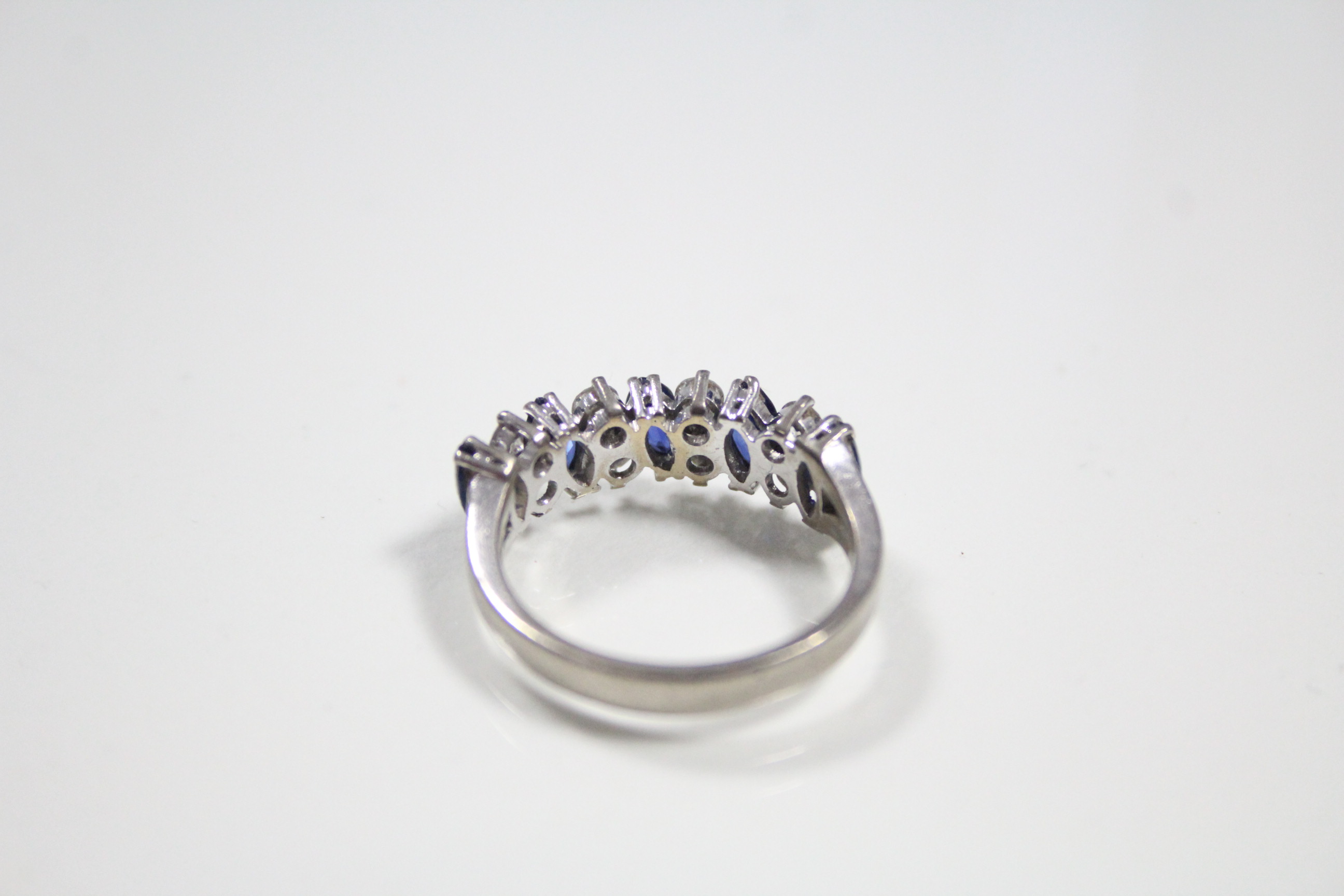 A SAPPHIRE & DIAMOND RING, the five navette-shaped sapphire set at a slight angle & divided by - Image 3 of 3