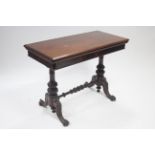 A Victorian mahogany card table, the rectangular fold-over top with green morocco leather to the