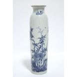 A Chinese blue & white porcelain sleeve vase painted with songbirds perched amongst peonies,