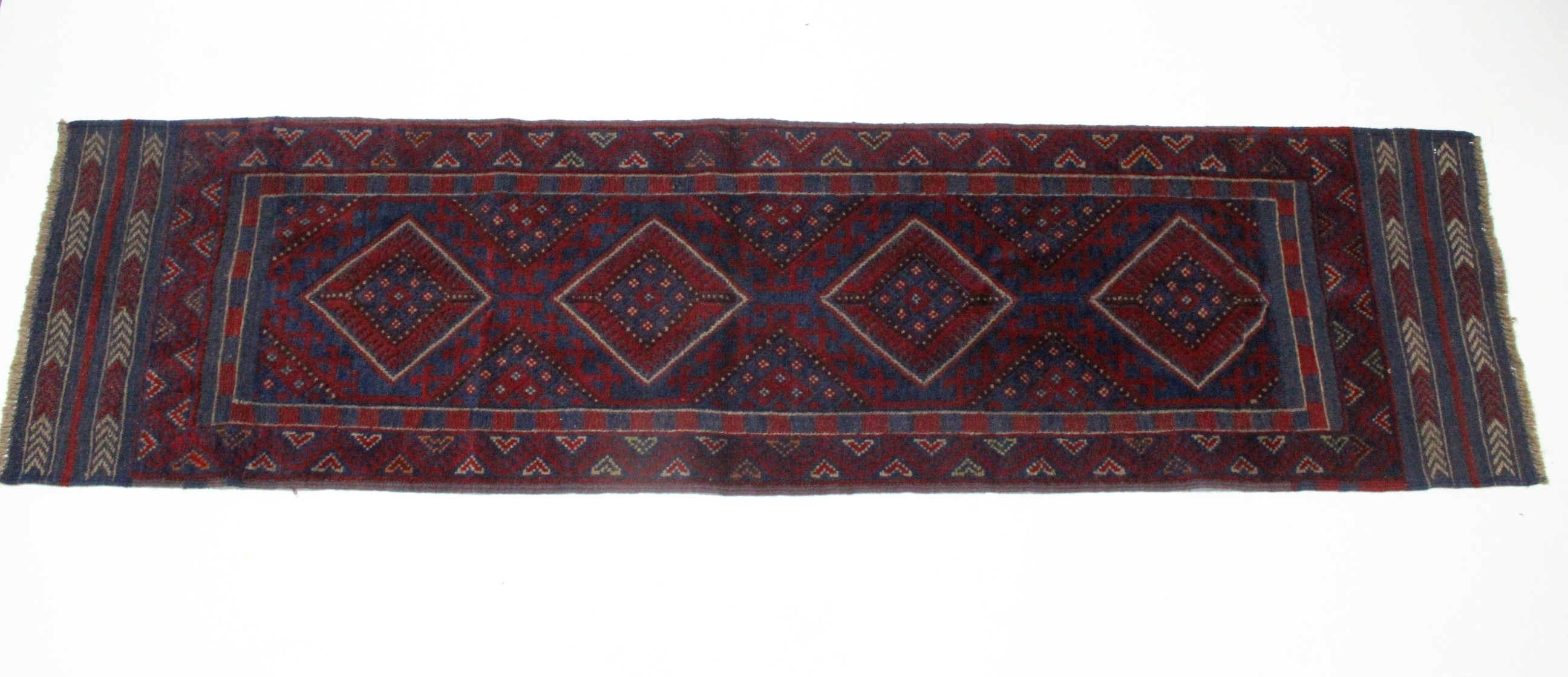 A Meshwari runner of crimson ground, with row of four lozenges to the centre in blue & ivory, wide - Image 3 of 3