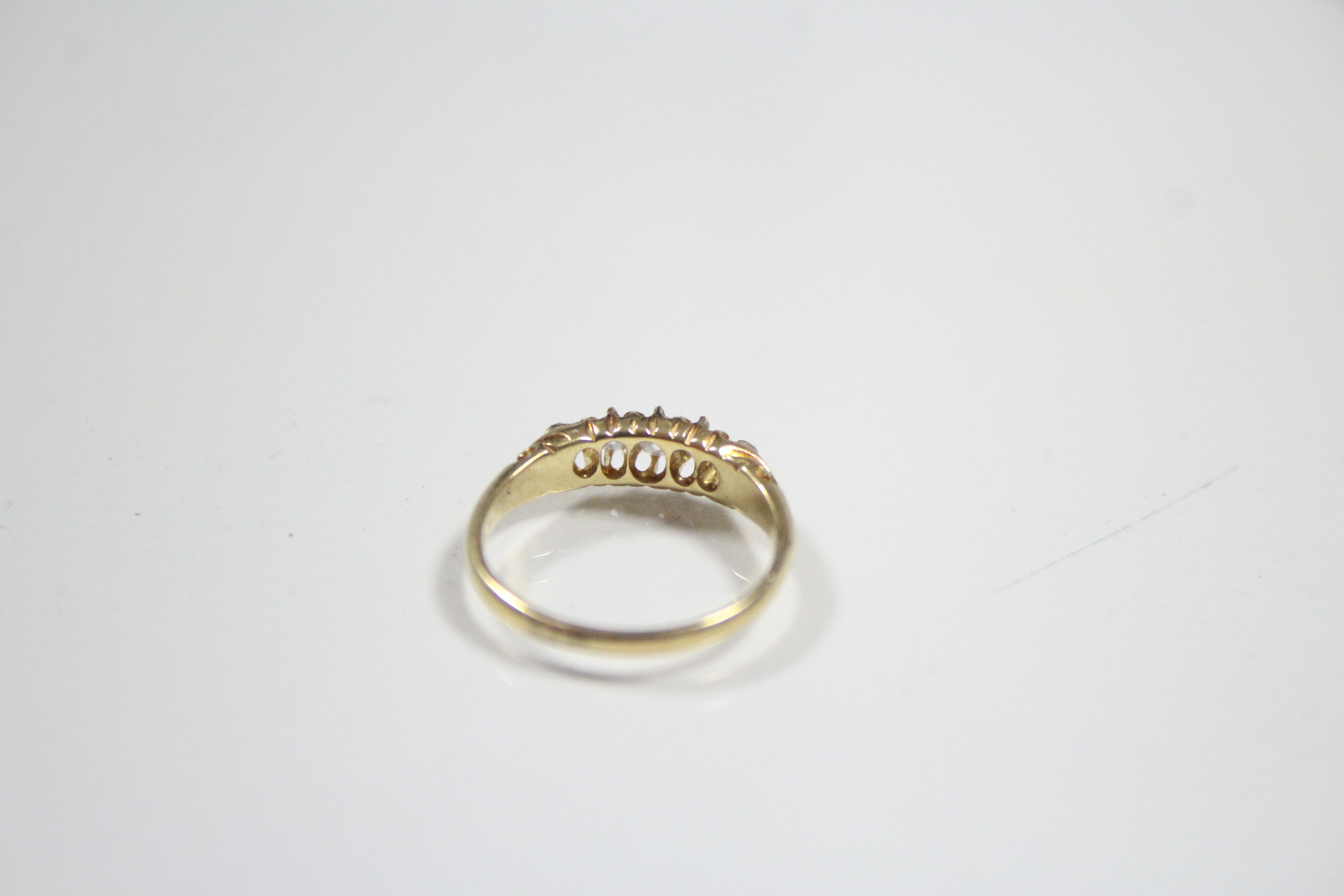 An 18ct. gold ring set row of five small graduated diamonds. - Image 2 of 2