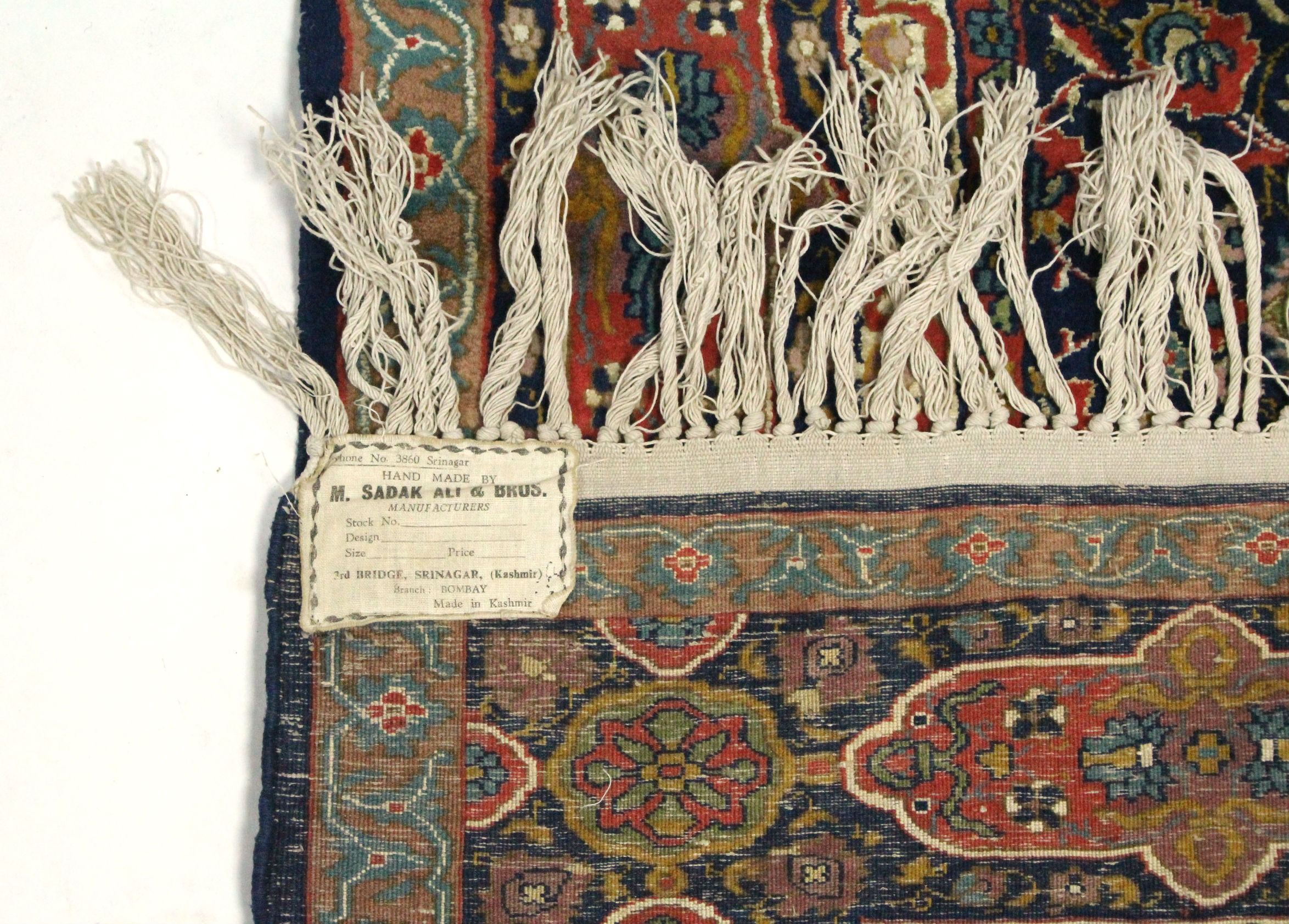 A Kashmir rug of deep blue ground, with centre medallion & all-over multicoloured floral design - Image 3 of 3