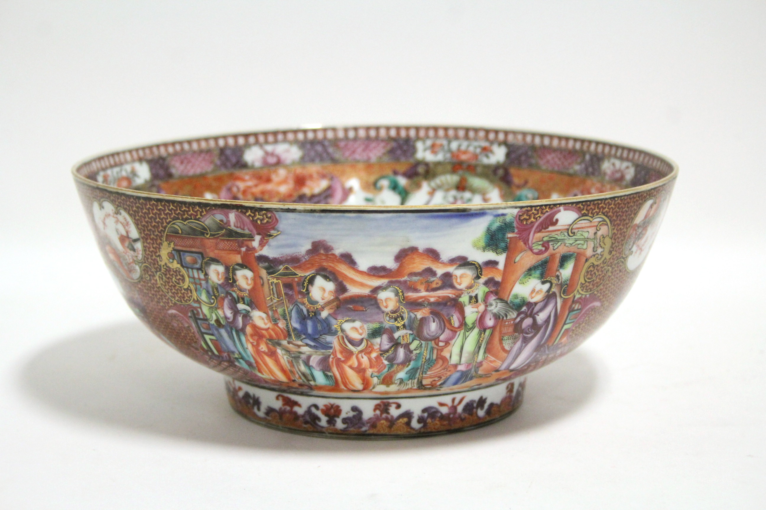 An 18th century Chinese porcelain "Mandarin" pattern punch bowl; 11¼" diam. (cracked).