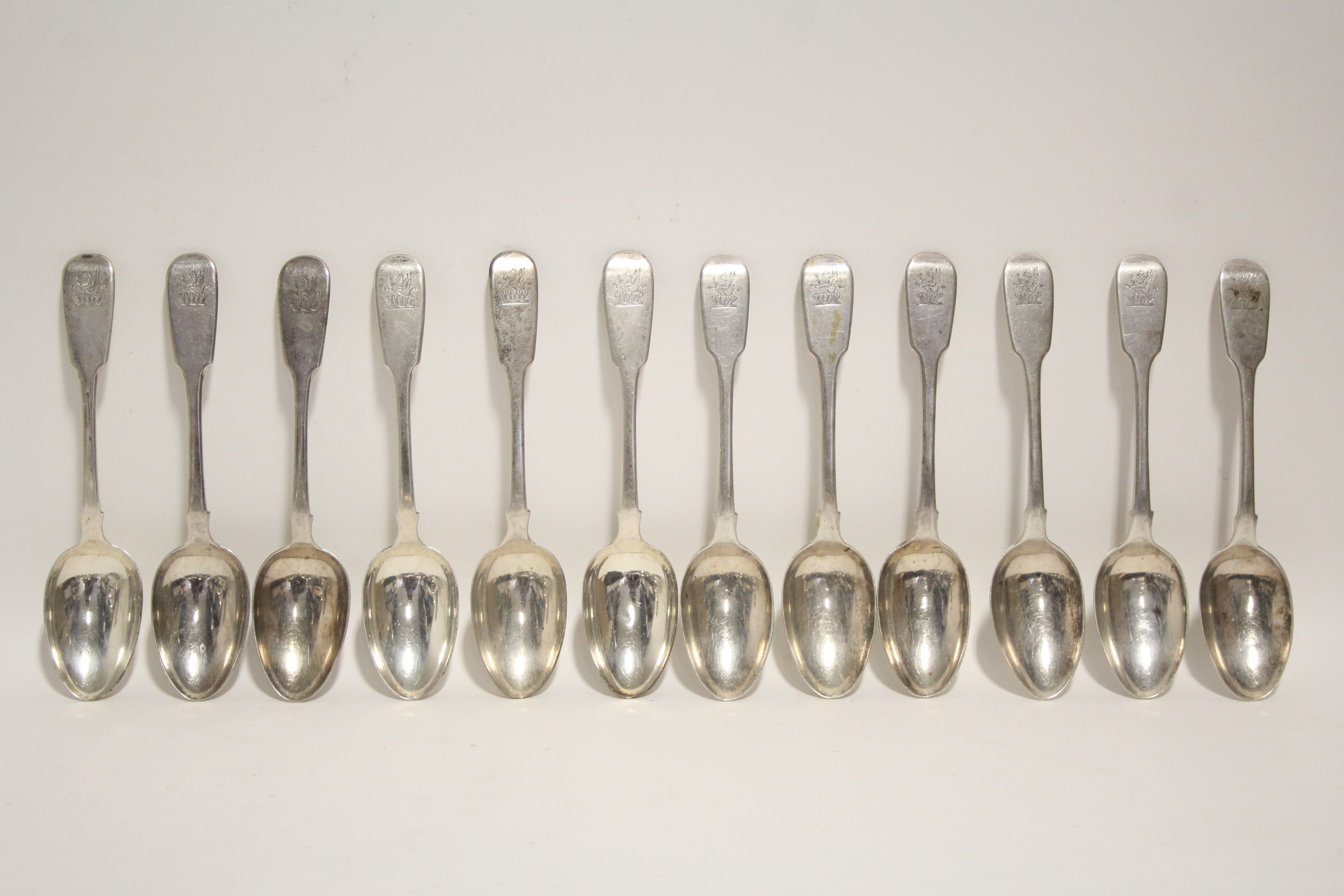 Six George IV Fiddle pattern dessert spoons; London 1829; & six William IV ditto, 1834; all by