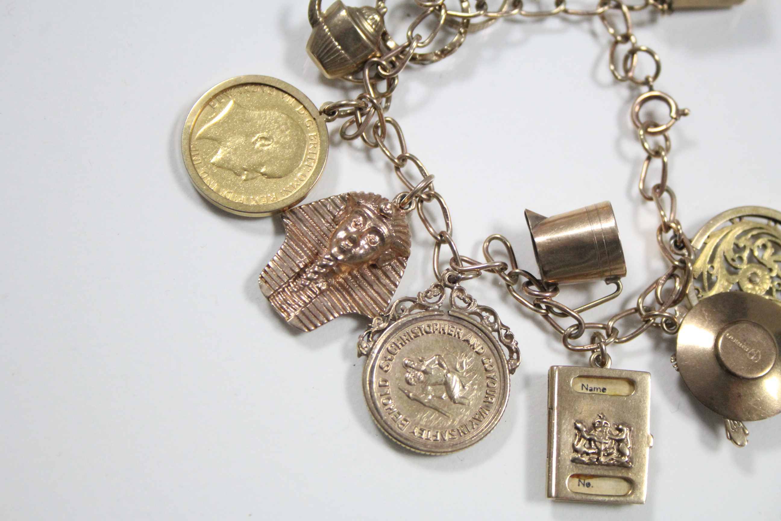 A 9ct. gold chain-link charm bracelet with pendant Edwardian half-sovereign (1901), eight various - Image 2 of 2