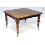 A VICTORIAN MAHOGANY EXTENDING DINING TABLE with pull-out action, having two additional leaves, on