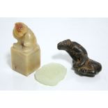 A Chinese carved pale green jade flat-sided pendant, 1¾"; a Chinese carved yellow soapstone seal