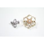 A white metal small ribbon-bow brooch set small diamonds; & a yellow metal openwork flower-head
