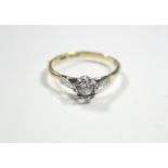 An 18ct. gold & platinum ring set single diamond of approximately 0.25 carat to a star-shaped