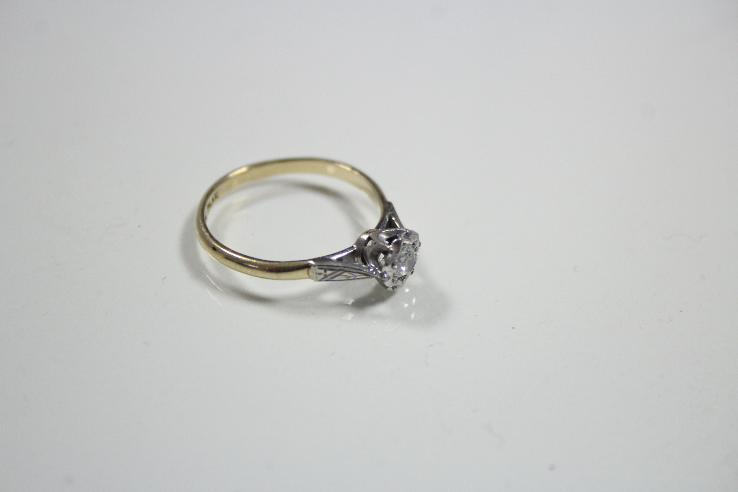 An 18ct. gold & platinum ring set single diamond of approximately 0.25 carat to a star-shaped - Image 2 of 2