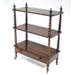 A mid-Victorian rosewood three-tier whatnot with barley-twist supports & urn finials, fitted