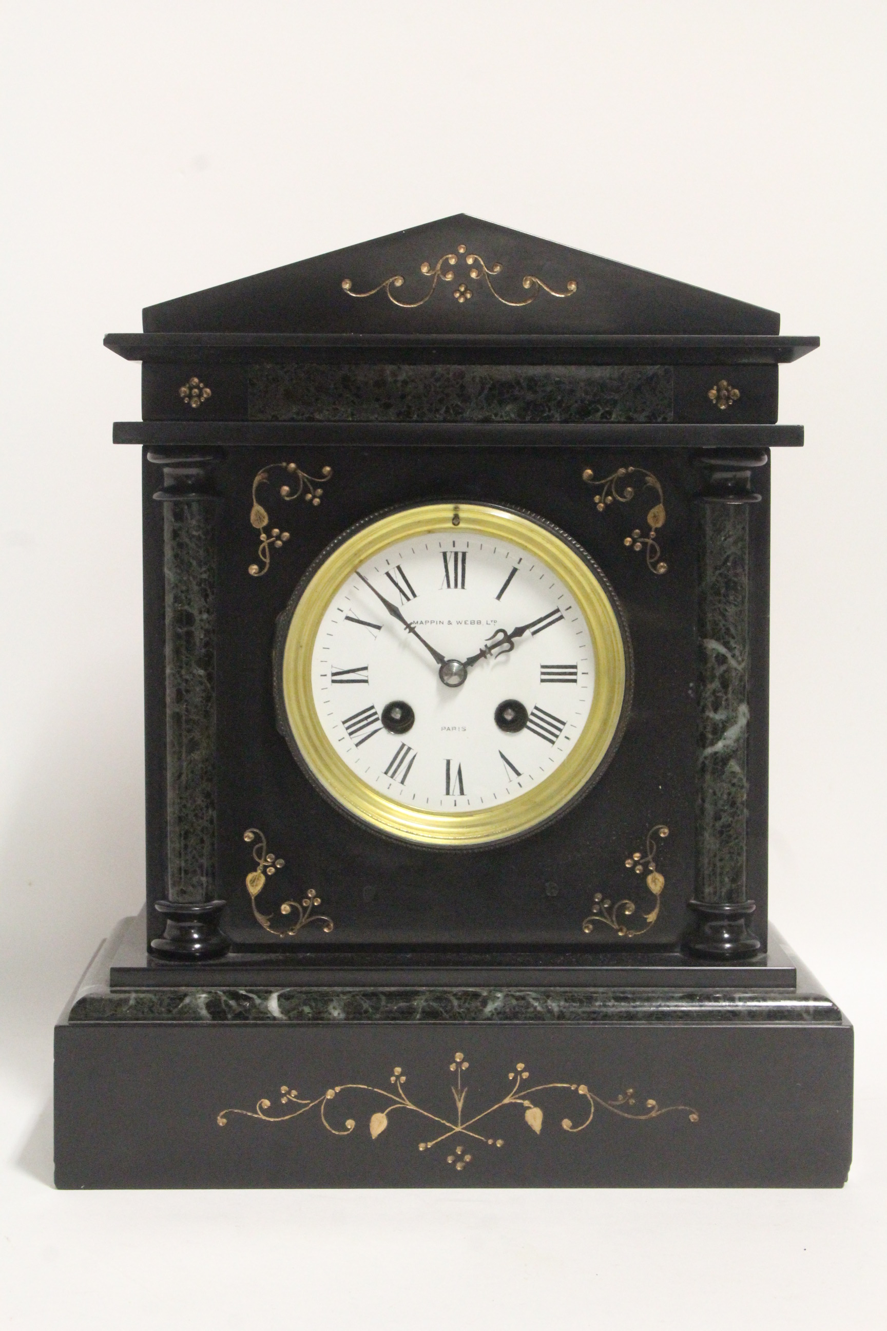 A Victorian striking mantel clock with 4" diam. white enamel dial, in black slate & green marble