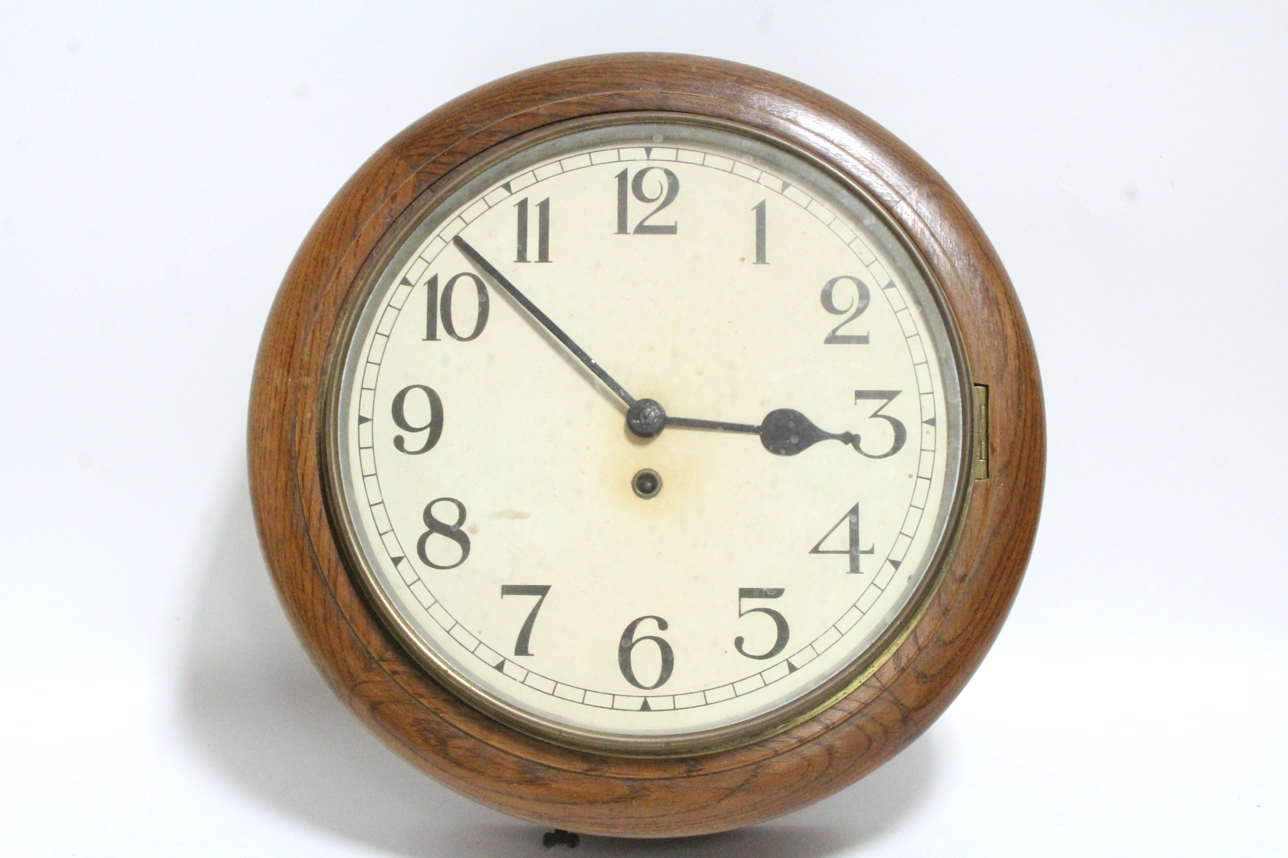 A late 19th/early 20th century wall timepiece with Arabic numerals to the 12" white painted dial, in