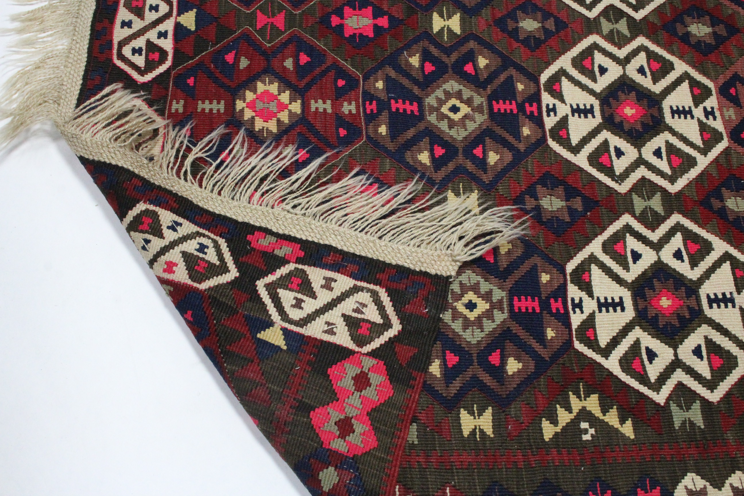 A Kelim rug with all-over brightly coloured geometric pattern & centre seam; 7’3” x 5’10”. - Image 3 of 4