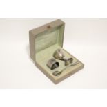 A German .800 standard egg cup, spoon, & napkin ring; in fitted case.
