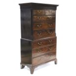 A late 18th century mahogany veneered chest-on-chest, fitted two short & six long graduated