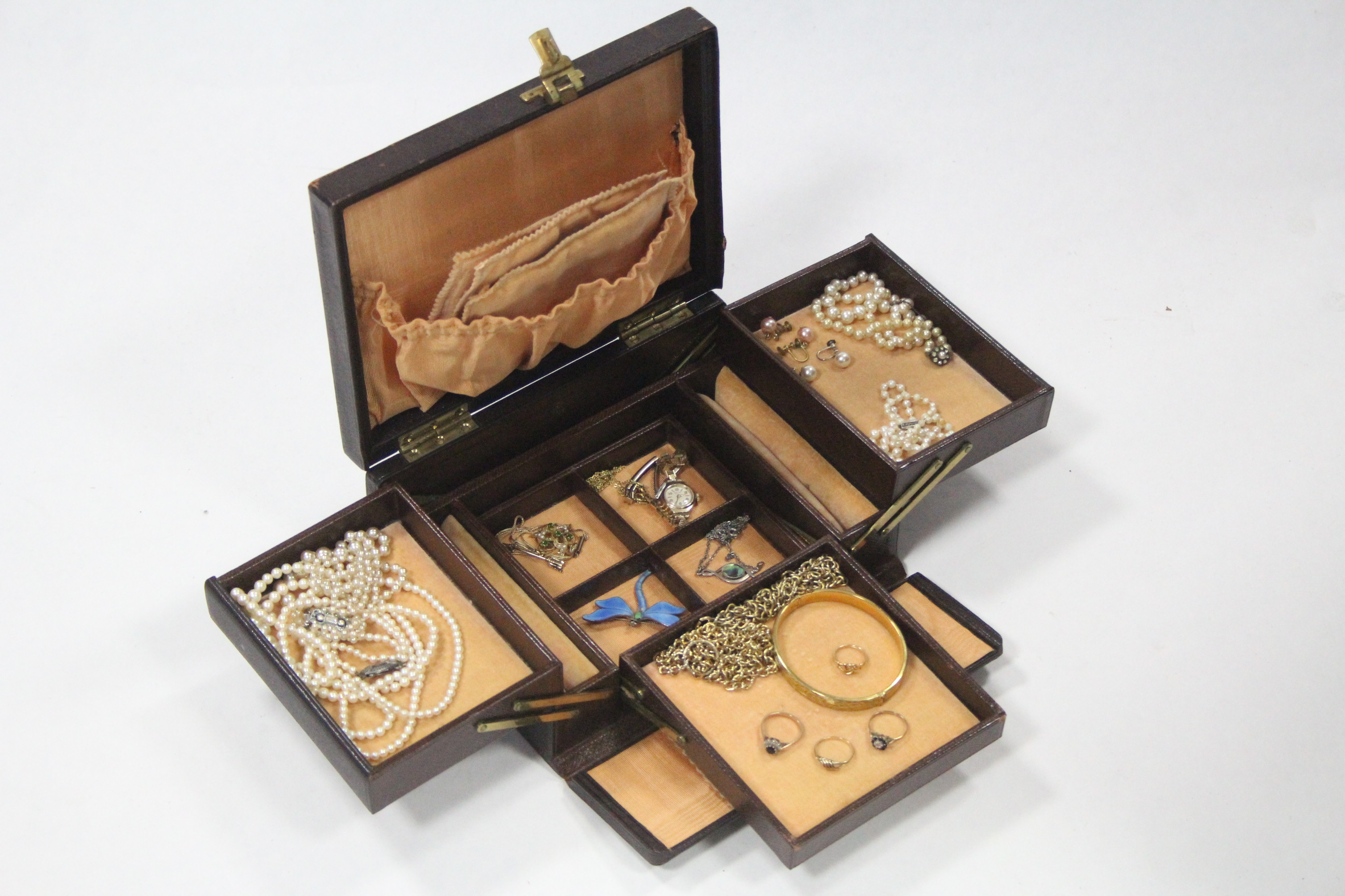 A morocco leather cantilever jewellery box, & contents of dress rings, costume jewellery, etc.