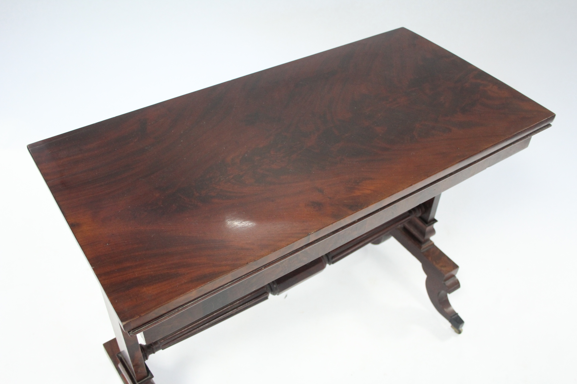 A late 19th century mahogany card table, with rectangular fold-over top on two end supports joined - Image 2 of 4