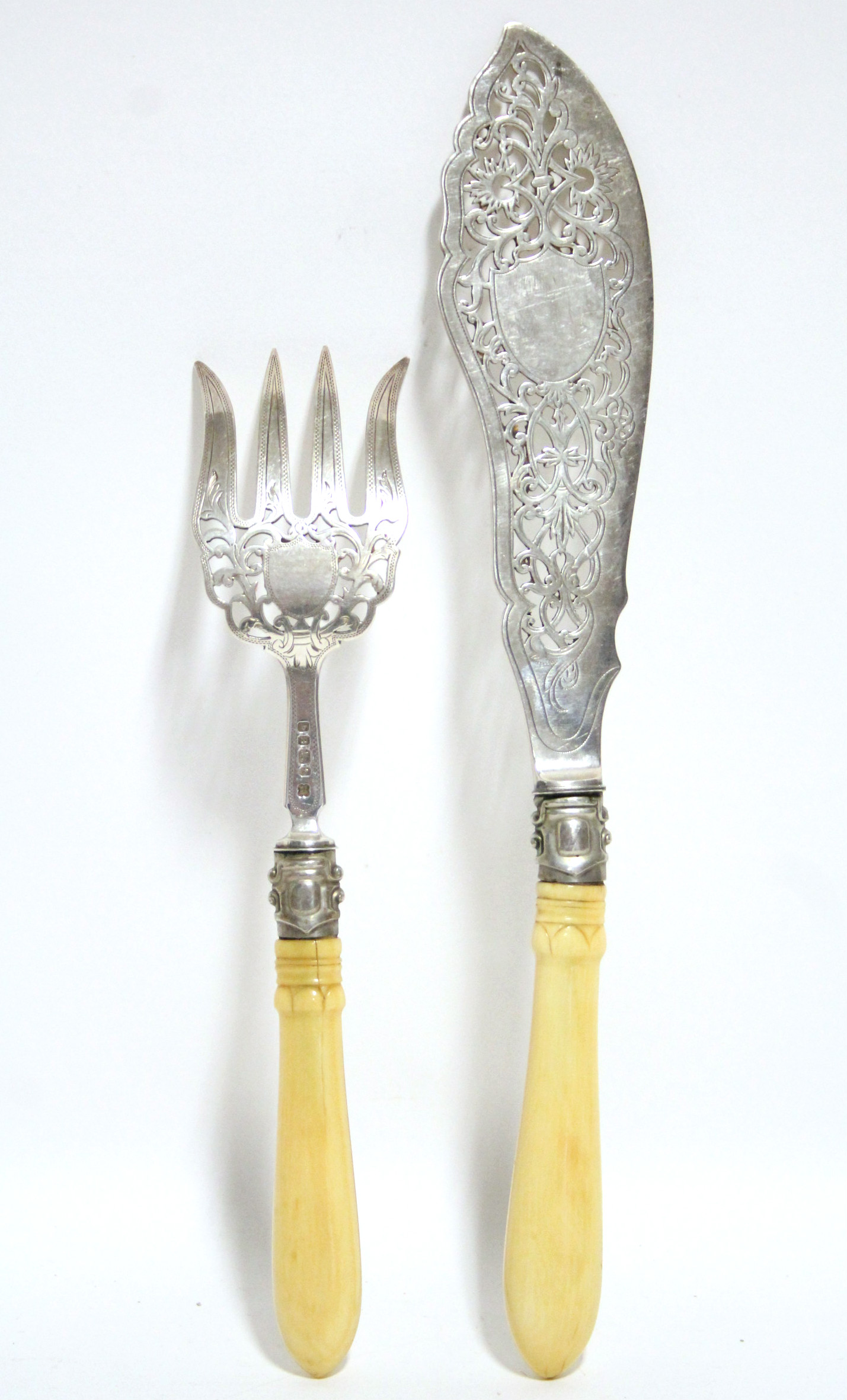 A pair of Victorian pierced & engraved fish servers with carved ivory handles; Sheffield 1869, by - Image 2 of 4