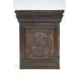 A 17th century style carved walnut & oak small cabinet enclosed by panel door with decoration of a