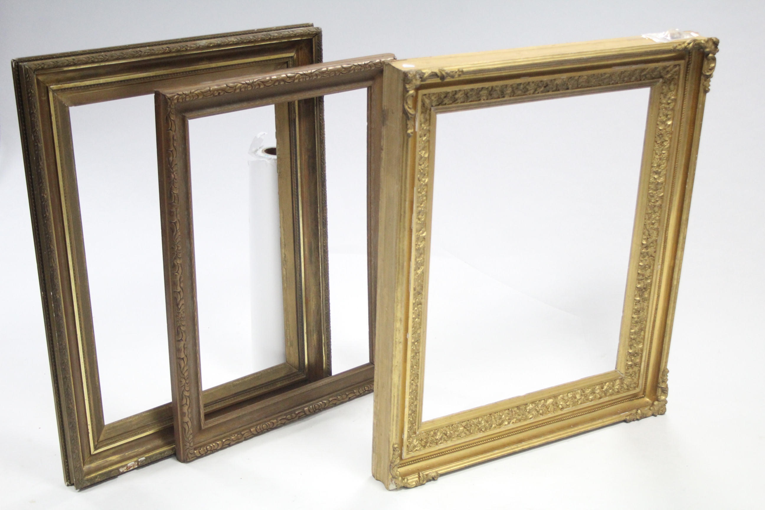 Three Victorian gilt gesso picture frames, internal measurements: 30½" x 24½"; 30½" x 21¼" & 30½"