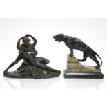 A bronzed speltre model of a prowling lioness, on onyx base, 5½" high x 6" wide; & a bronzed resin