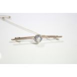 A 15ct. gold bar brooch set large pale aquamarine; a 15ct. gold stick pin set small diamond; a 15ct.