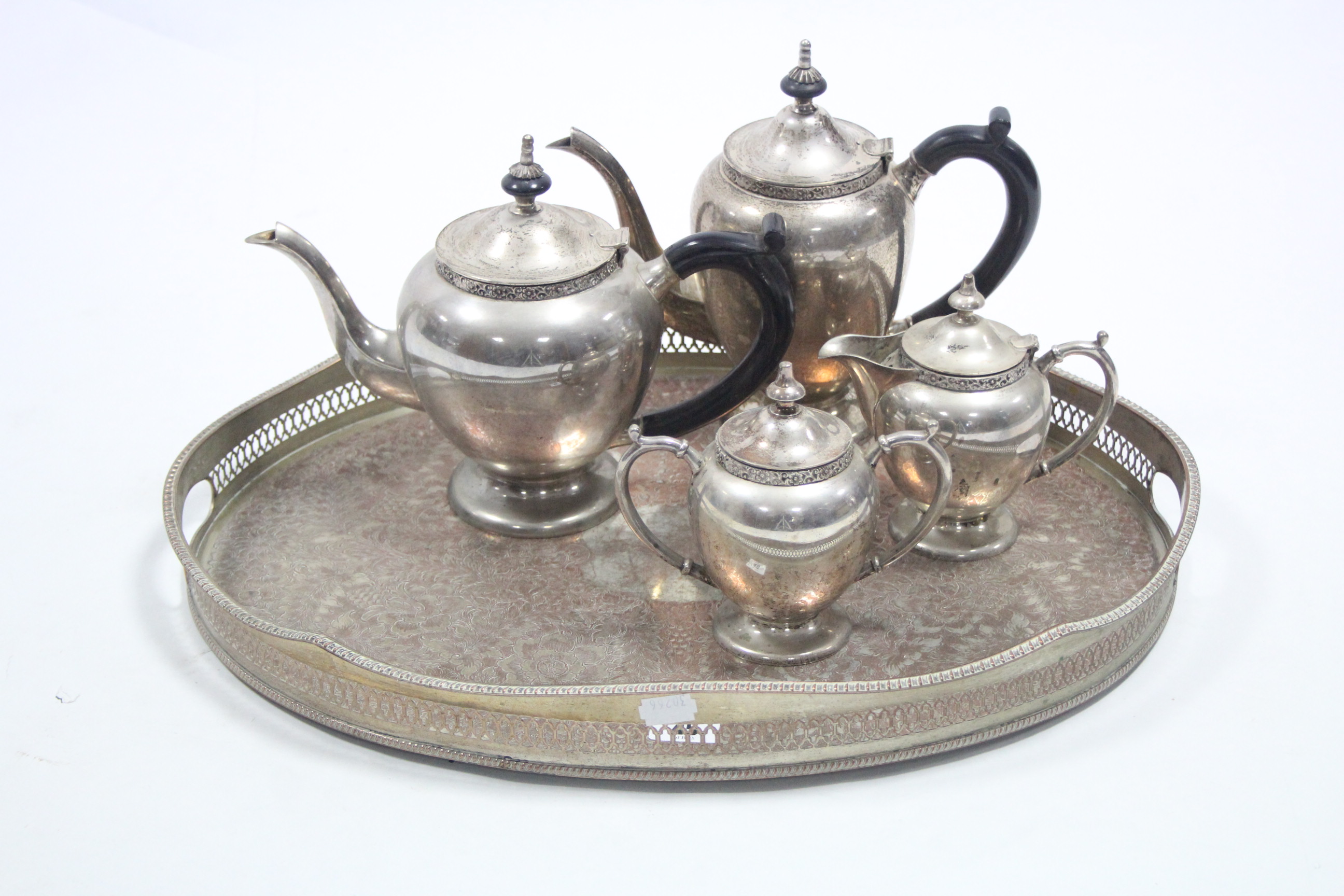 An Indian electro plated four piece tea & coffee service; & an engraved silver plated oval two-