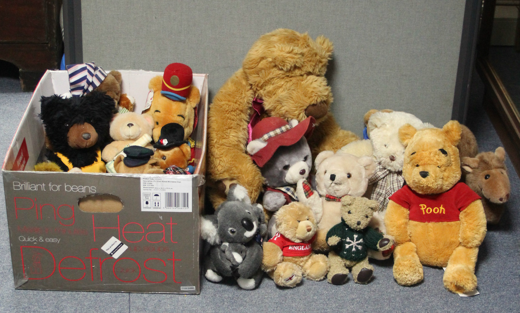 A collection of approximately fifty soft toys.
