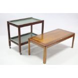 A teak rectangular two-tier tea trolley inset green-finish metal trays, & on square legs 30” wide; &
