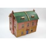 A large paper-covered wooden two-storey doll’s house with opening front & with electrical