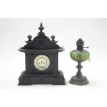 A Spelter oil table lamp with green glass reservoir having raised geometric design; & an early
