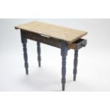 A pine side table with rectangular top, fitted end drawer & on turned legs, 35¼” wide.