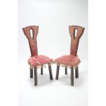 A pair of continental-style hall chairs with narrow tapered backs & padded seats upholstered brass-