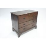 A late 18th century oak chest in two sections, with hinged lift-lid & deep mock drawer to the