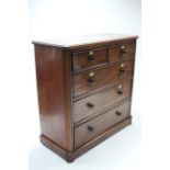 A Victorian mahogany chest fitted two short & three long graduated drawers with turned knob handles,