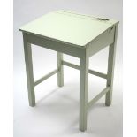 A pale green painted wood sloping-front child’s desk on square legs with plain stretchers, 24”